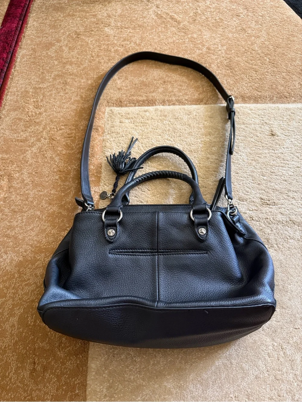 The Sak Black Leather Tote Bag with Tassel Accent